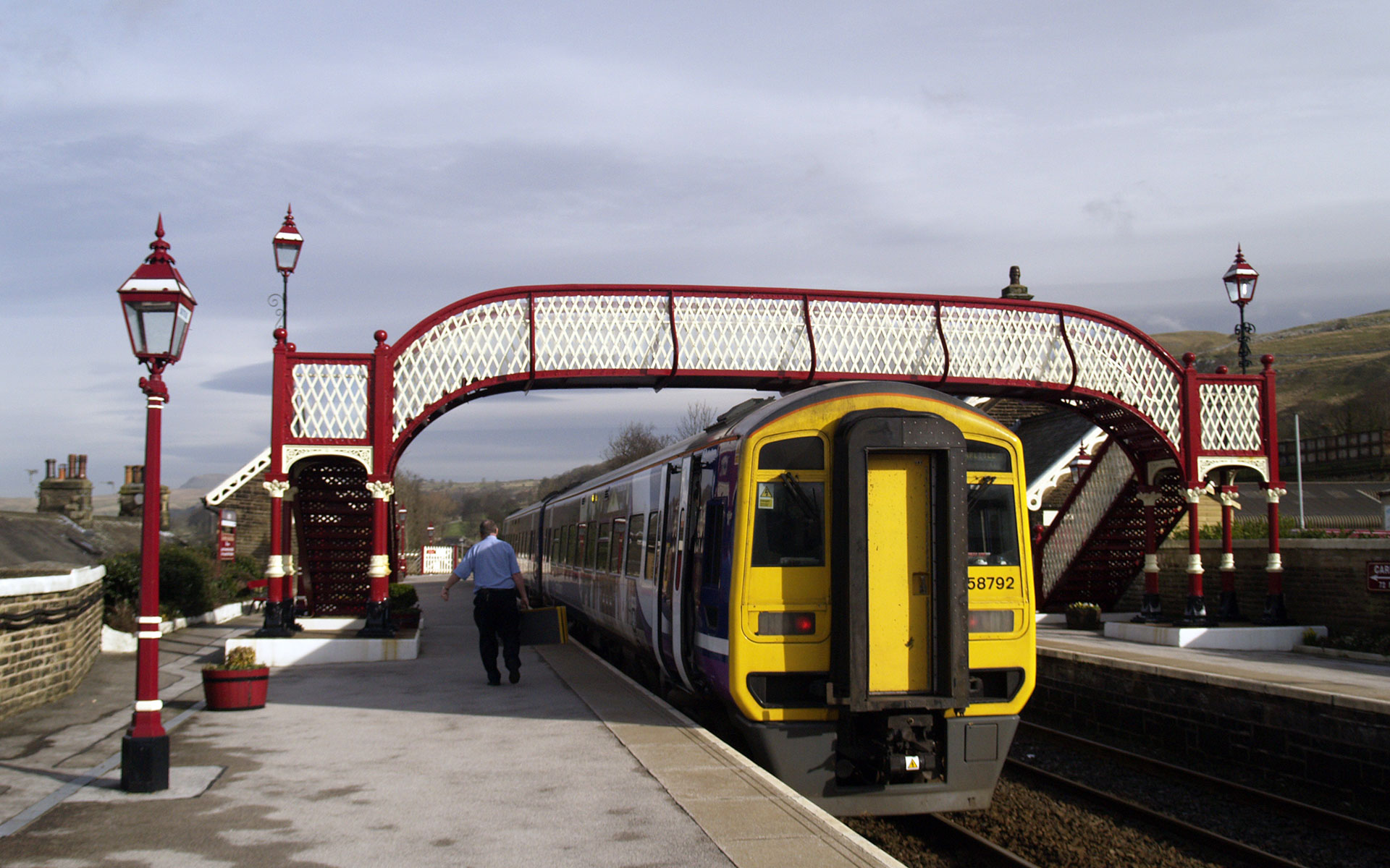 A northbound Northern Rail service pauses at Settle en route to Carlisle (photo © hidden europe).