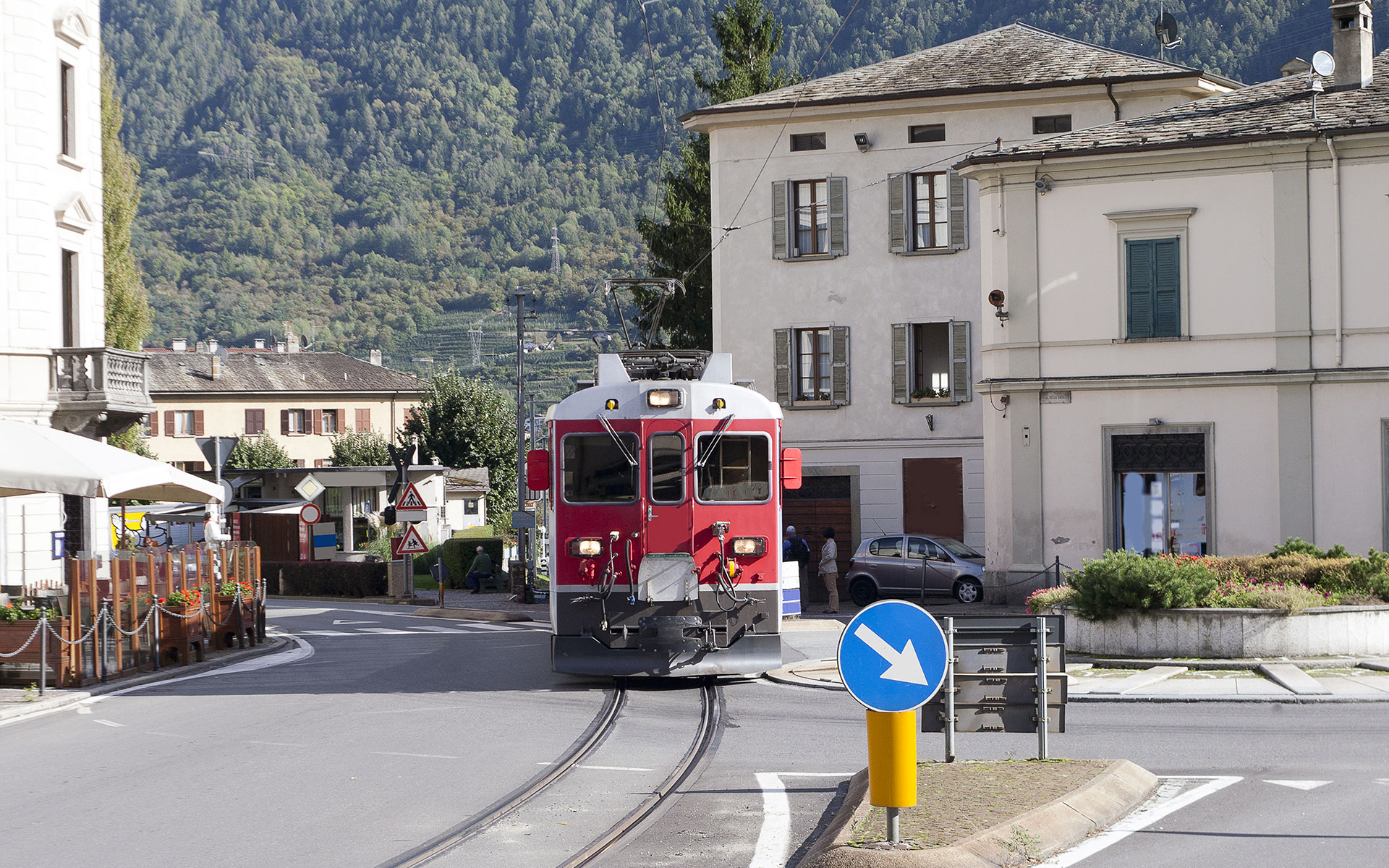 A Swiss train on the Bernina route arrives in Tirano. The railway actually threads through the streets of the Italian town (photo © Janis Smits / dreamstime.com)