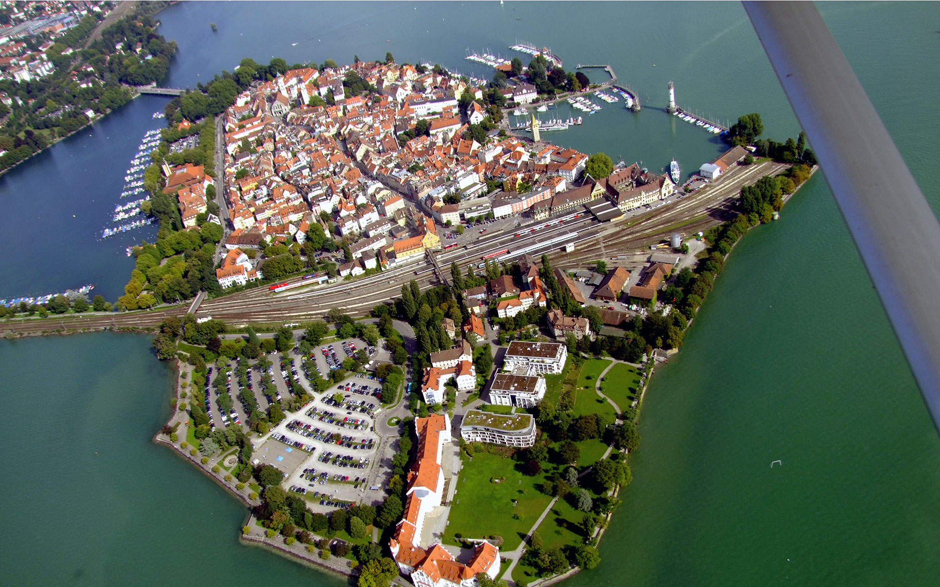 Aerial view of Lindau Island in Lake Constance - where the town's station (Hauptbahnhof) and railway lines take up much space. A new mainland station. more convenient for most Lindau residents, will open in December 2020 (photo © Potteret / dreamstime.com).
