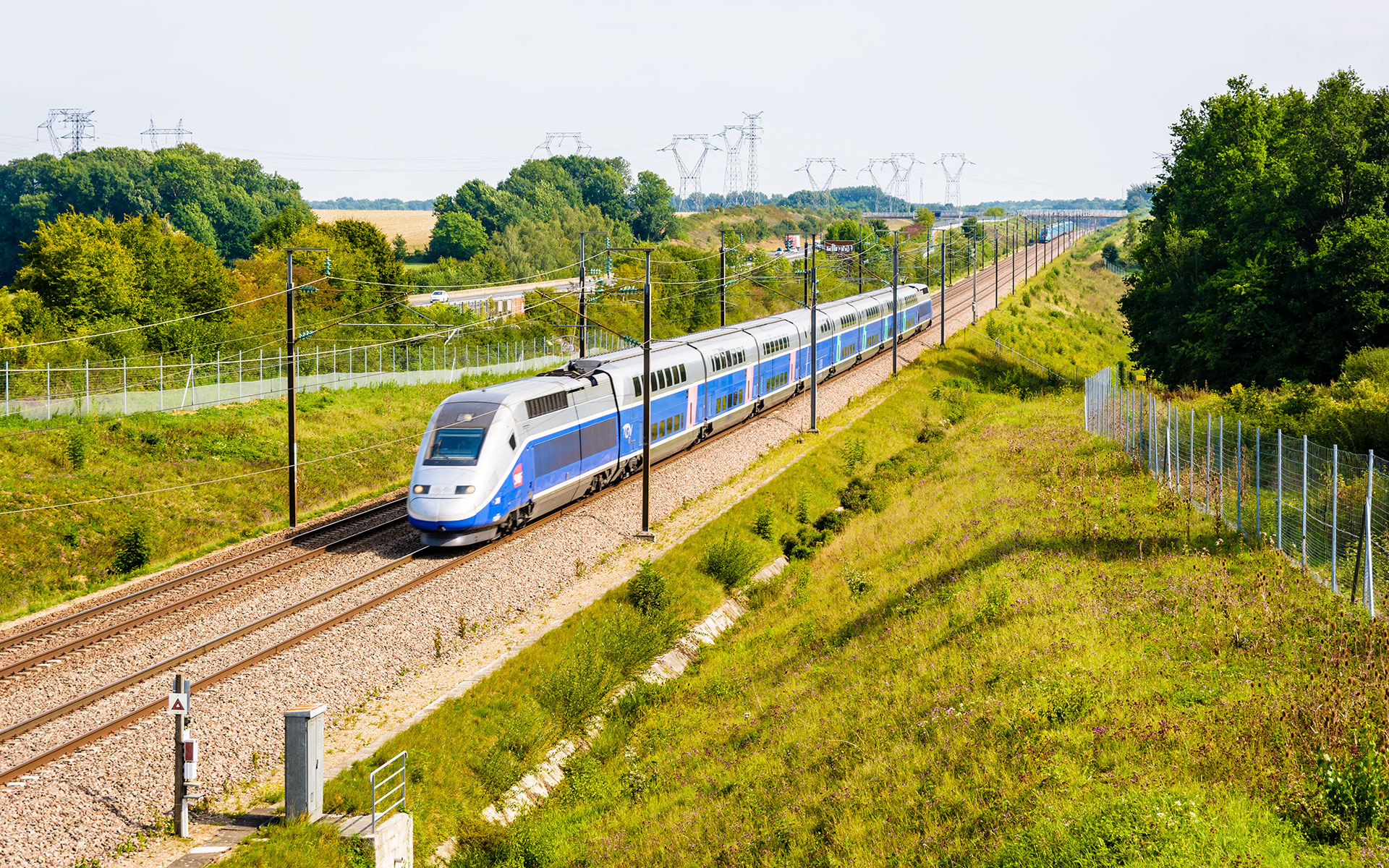 A double-deck French TGV speeds along the Sud-Est line about 40 km south-east of Paris (photo © Olrat / dreamstime.com).
